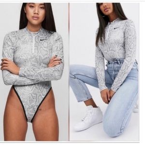 Nike. Snake print body suit. Size M. Gray